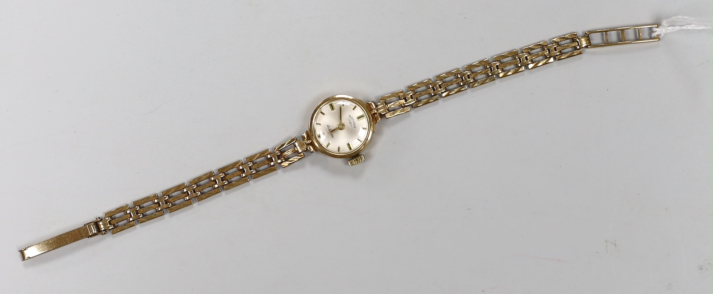 A lady's 9ct gold Rotary manual wind wrist watch, on associated 9ct gold bracelet, overall 17cm